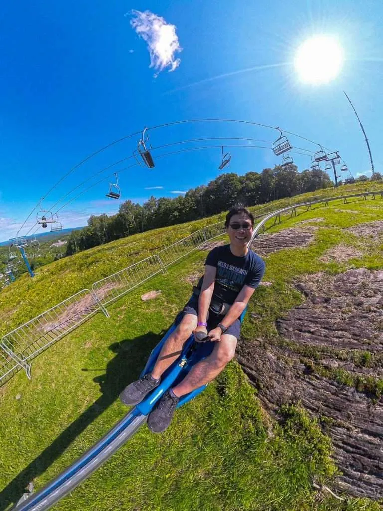 Raymond Cua riding the thrilling mountain gravity coaster at Camp Fortune, a top thing to do in Chelsea.