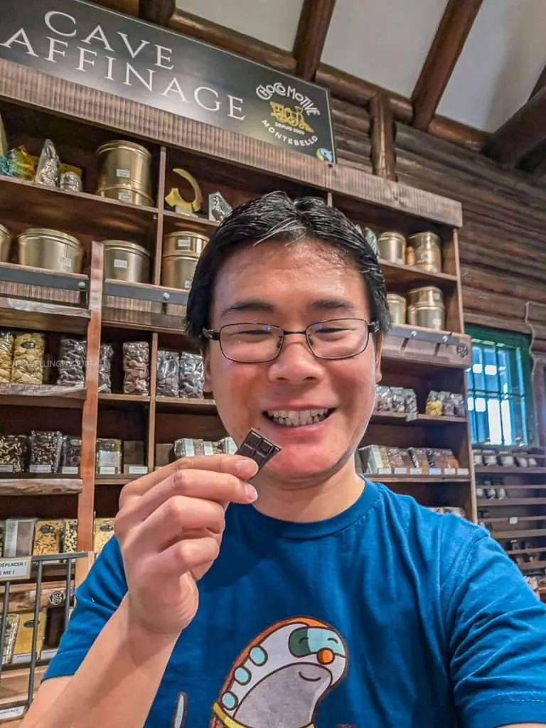 Travelling Foodie Raymond Cua tasting aged artisanal chocolate inside the ChocoMotive economuseum during a Montebello trip.