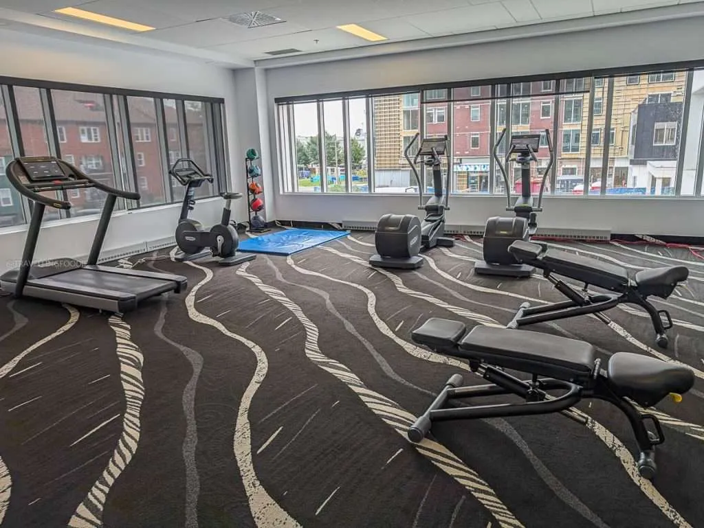 The fitness center gym with large windows at Delta Hotels by Marriott, one of the best hotels in Trois-Rivieres