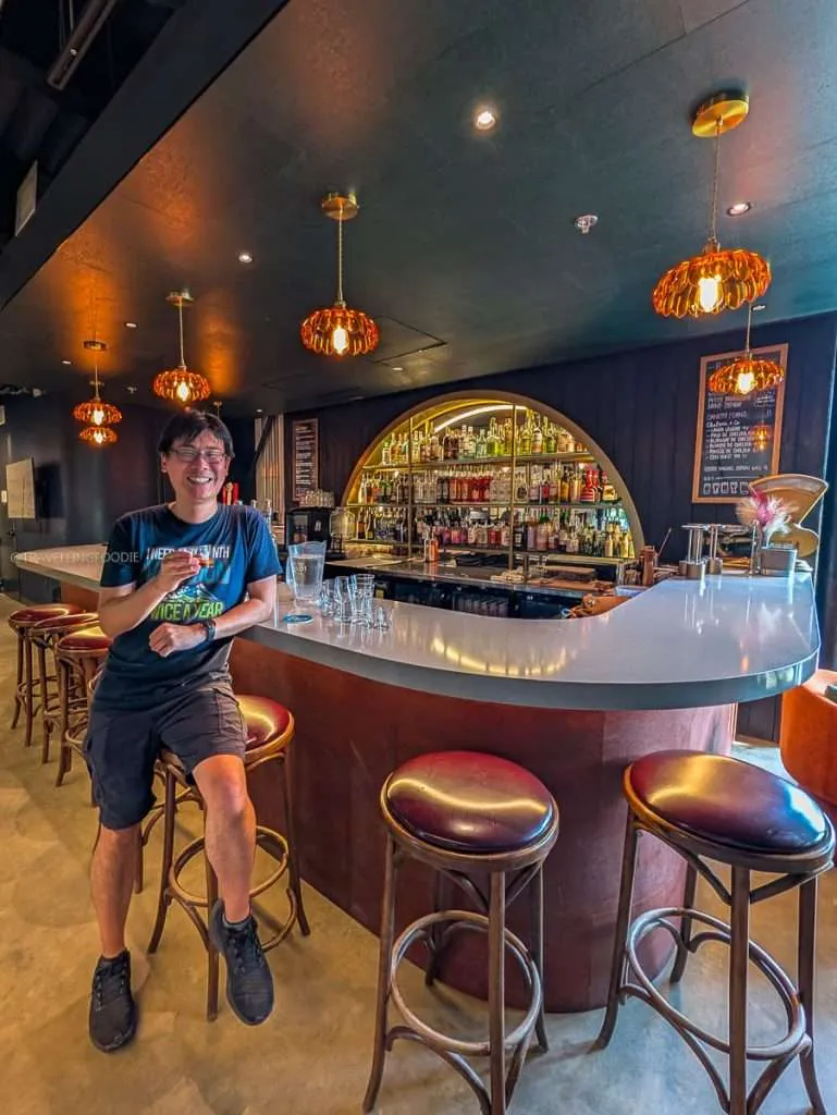 Travelling Foodie Raymond Cua at La Cocktailerie, the speakeasy bar inside Distillerie du Square during a Chelsea Quebec road trip.