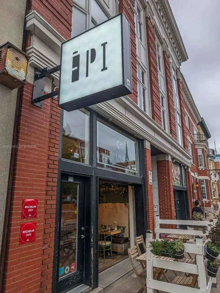 The exterior of Épi, buvette de quartier with its Michelin plaques in Trois-Rivieres during my Authentic Quebec trip
