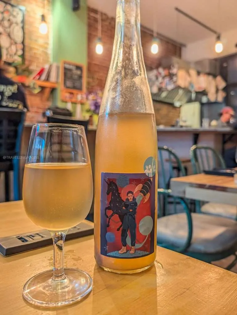 A glass of Jan-Philipp Bleeke orange wine at Épi, buvette de quartier in Trois-Rivieres Authentic Quebec