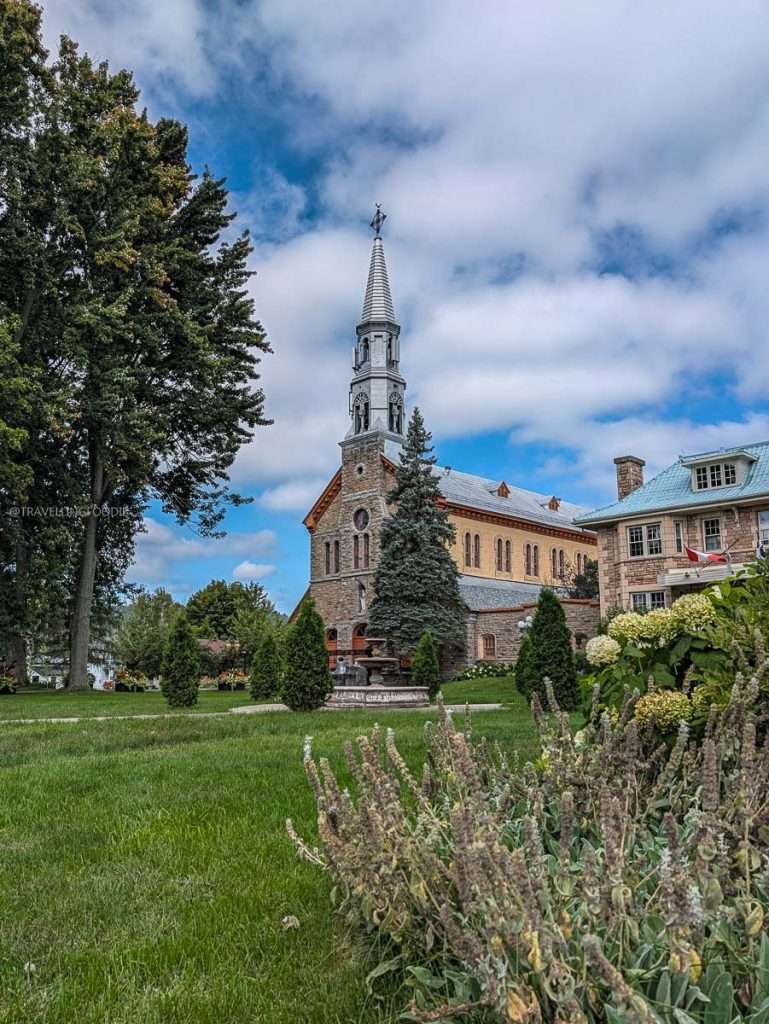 The beautiful historic Fabrique Notre-Dame de Bonsecours church exterior, a popular landmark in Montebello, Quebec.