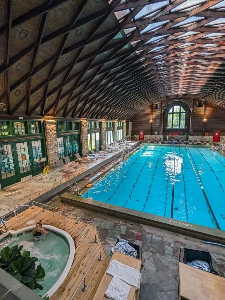 The massive indoor swimming pool and jacuzzi inside the luxurious health center at Fairmont Le Chateau Montebello.