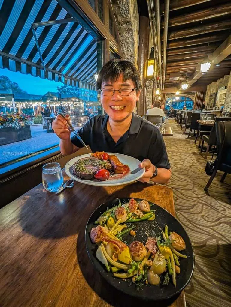 Raymond Cua dining on beef prime rib and scallops at Aux Chantignoles in Montebello Quebec.