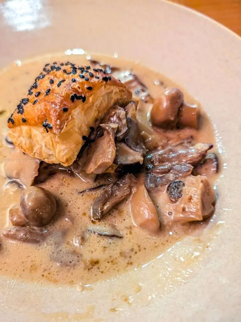 Le Coprin farm mushrooms in cream sauce with flaky puff pastry at L'Oree du Bois fine dining in Chelsea Quebec.