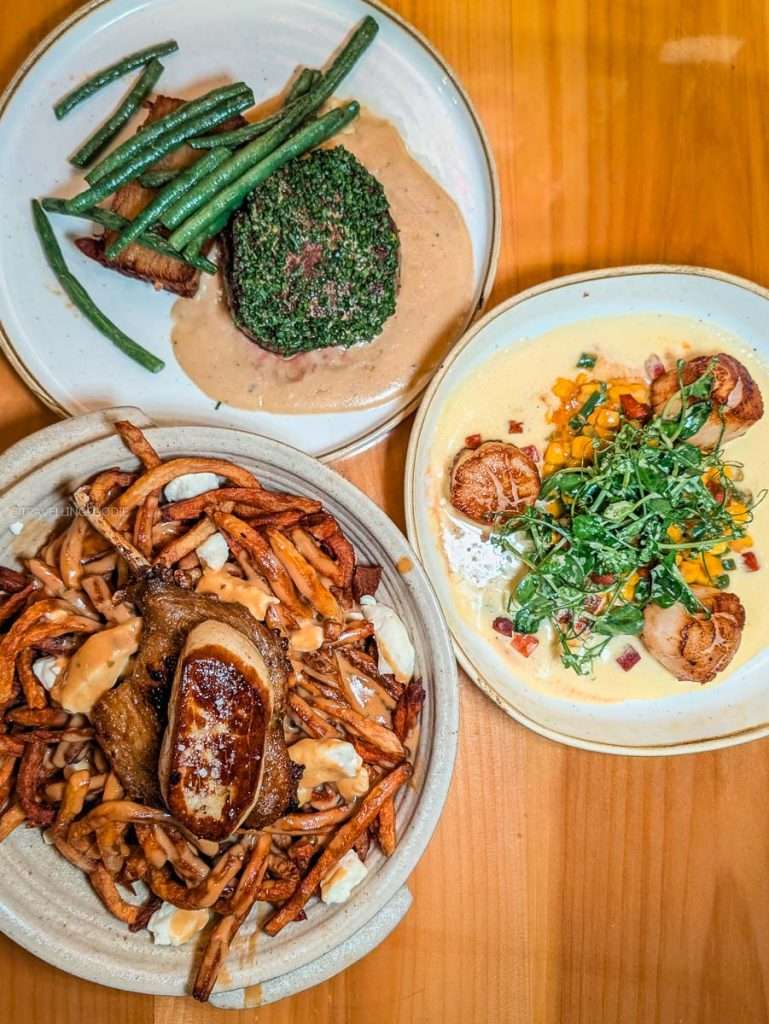 Cataclysm duck poutine, pan-seared scallops, and beef filet mignon dishes at L'Oree du Bois in Chelsea Quebec.