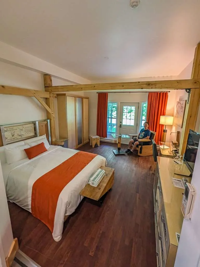 My spacious Ambiance Room with rustic decor at Le Baluchon eco-resort during my luxury Authentic Quebec trip