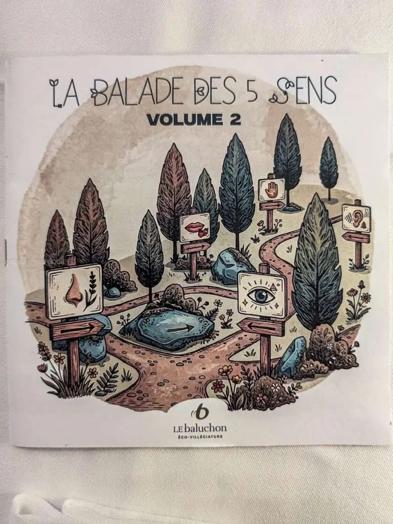 The beautiful hand-drawn tasting menu for the Walk of the 5 Senses dinner at Le Baluchon eco-resort