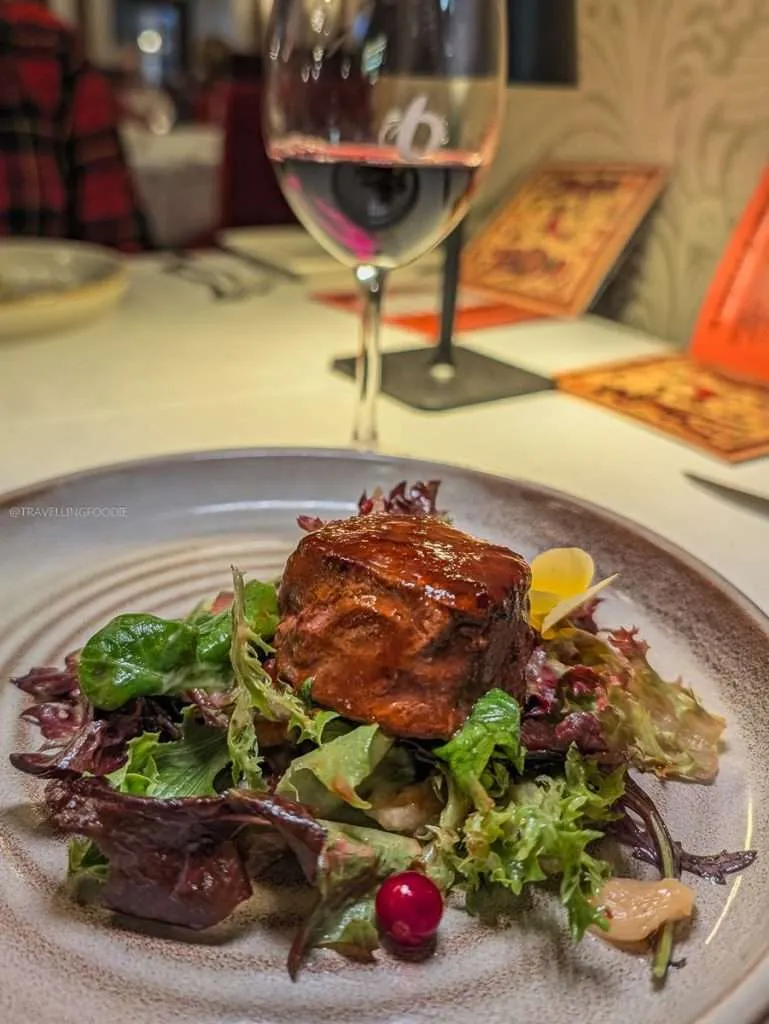 Charcoal grilled wild boar with rich foie gras sauce at Le Baluchon during our Lanaudiere-Mauricie culinary trip