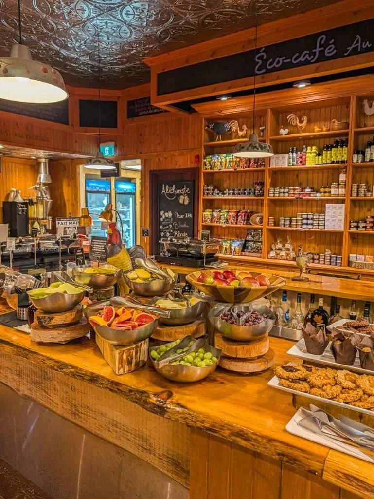 Fresh fruits and local baked goods at the Eco Cafe breakfast buffet before exploring the heart of Authentic Quebec