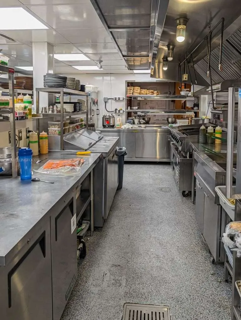 A peek inside the spotless stainless steel kitchen at Le Baluchon Eco-Cafe in Authentic Quebec.