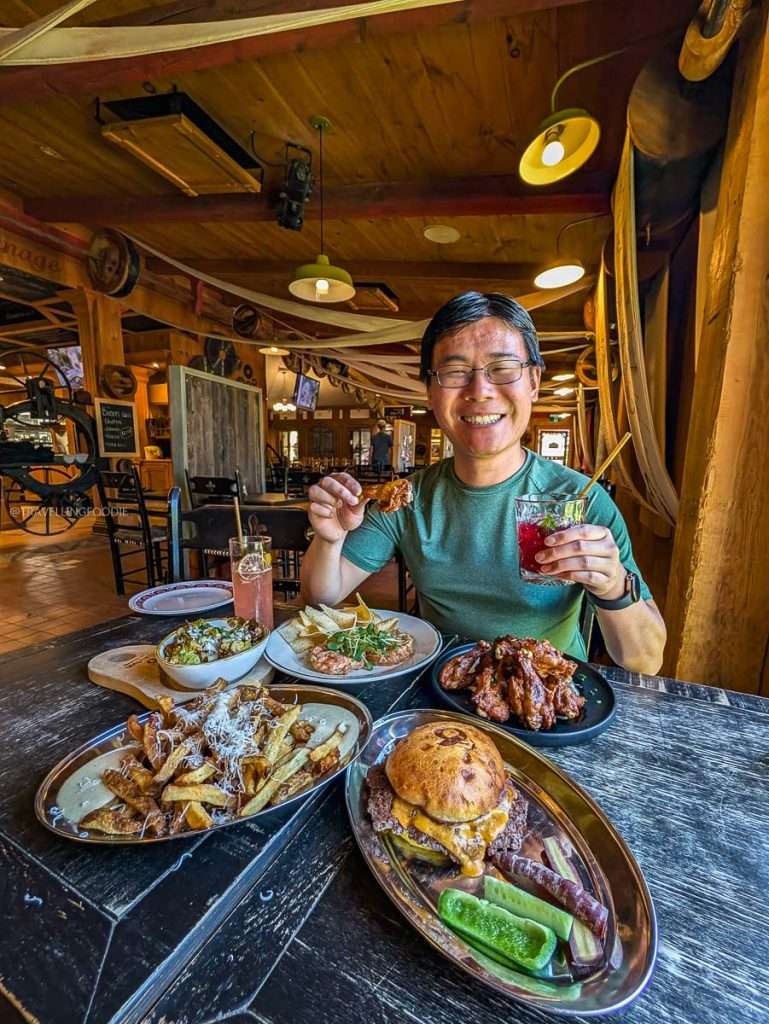 Travelling Foodie Raymond Cua enjoying huge portions of comfort food and refreshing cocktails at Le Baluchon in Authentic Quebec