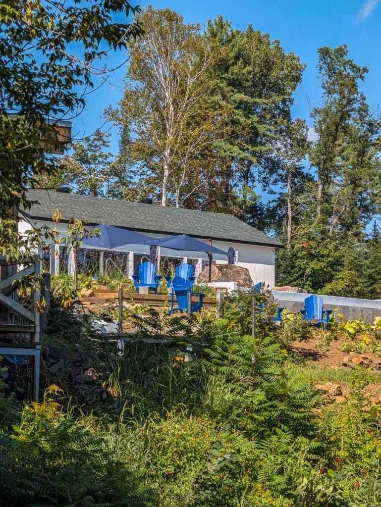 Blue relaxing chairs outside the Nordik spa at Le Baluchon eco-resort in Lanaudiere-Mauricie