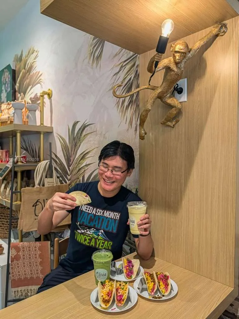 Raymond Cua enjoying fresh healthy tacos and a smoothie at Olivia Bistro, a top Chelsea restaurant